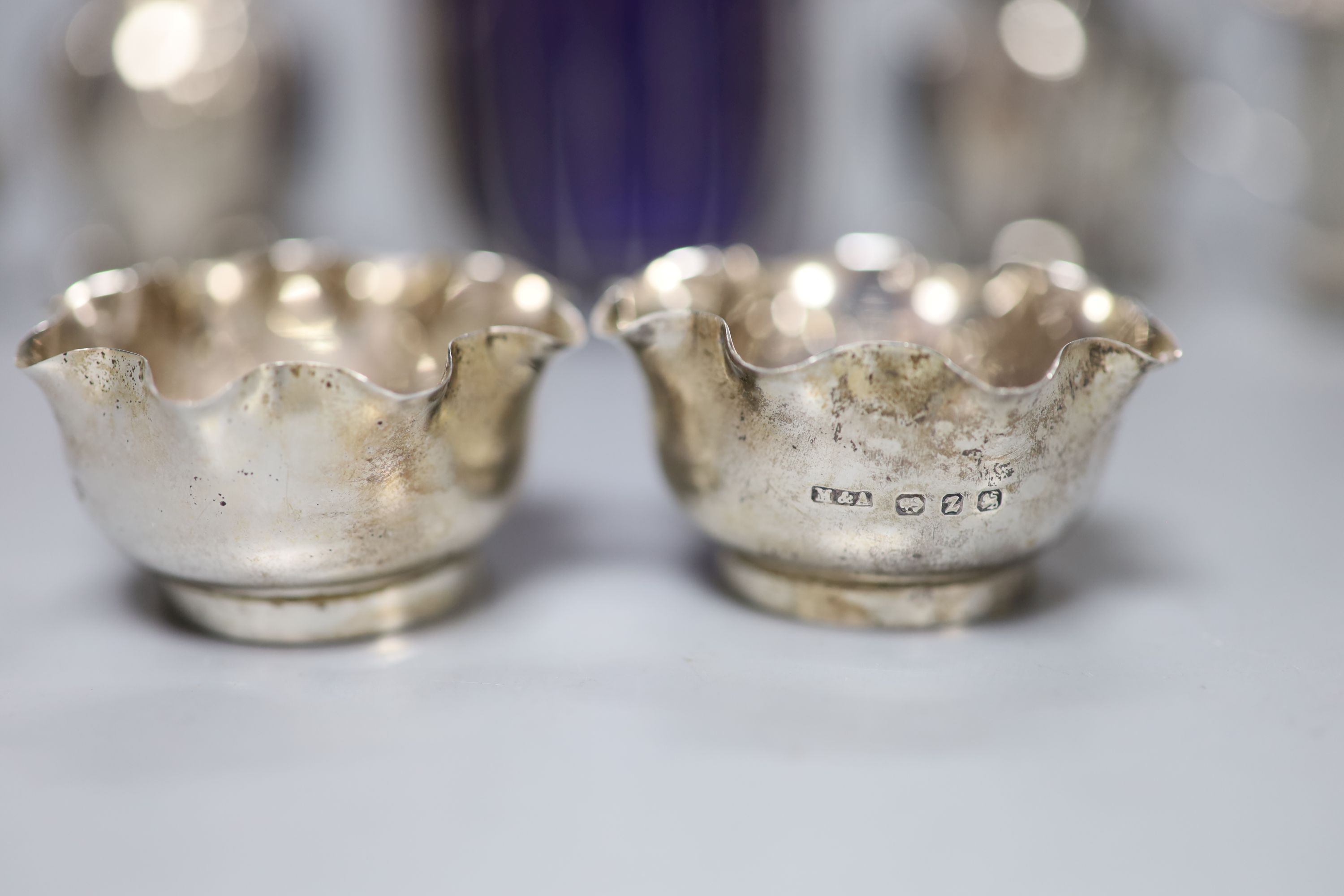Eight assorted 20th century silver condiments including two mustard pots.